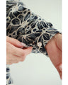 A floral embroidered pullover top with sparkling fine sequins