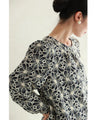 A floral embroidered pullover top with sparkling fine sequins