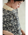 A floral embroidered pullover top with sparkling fine sequins