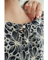 A floral embroidered pullover top with sparkling fine sequins