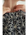 A floral embroidered pullover top with sparkling fine sequins