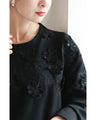 Sequined sparkling black floral applique pullover top