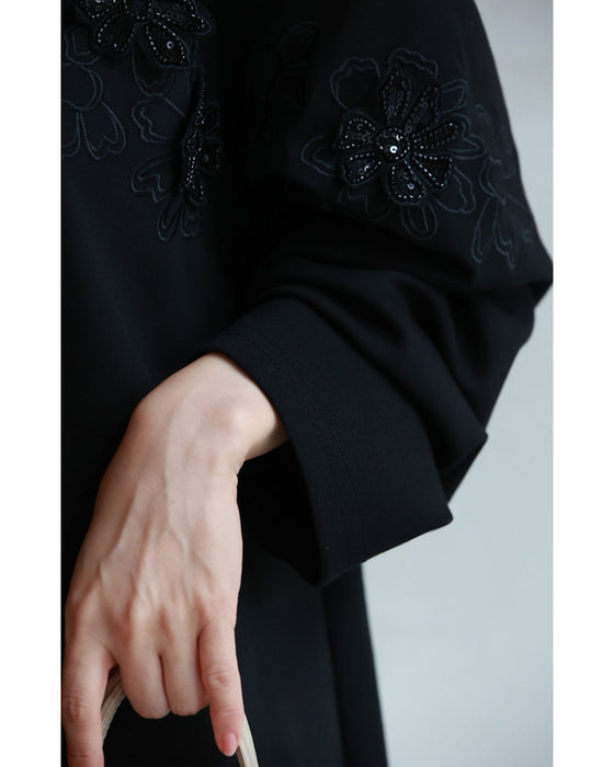 Sequined sparkling black floral applique pullover top