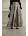 A tucked long skirt with nuanced art