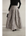 A tucked long skirt with nuanced art
