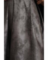 A tucked long skirt with nuanced art