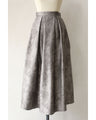 A tucked long skirt with nuanced art