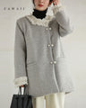 A pearl button coat with sparkling beaded daisy frills