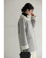 A pearl button coat with sparkling beaded daisy frills
