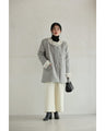 A pearl button coat with sparkling beaded daisy frills