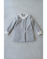 A pearl button coat with sparkling beaded daisy frills