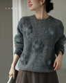 Knitted pullover top with appliqued flowers