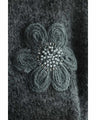 Knitted pullover top with appliqued flowers