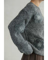 Knitted pullover top with appliqued flowers