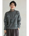 Knitted pullover top with appliqued flowers