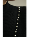 Ribbed knit cut-and-sew top with overlapping tulle ruffles and jewels