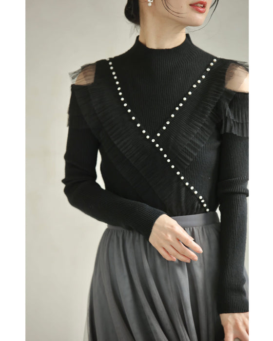 Ribbed knit cut-and-sew top with overlapping tulle ruffles and jewels