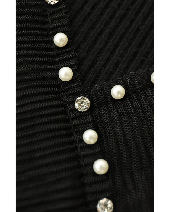 Ribbed knit cut-and-sew top with overlapping tulle ruffles and jewels