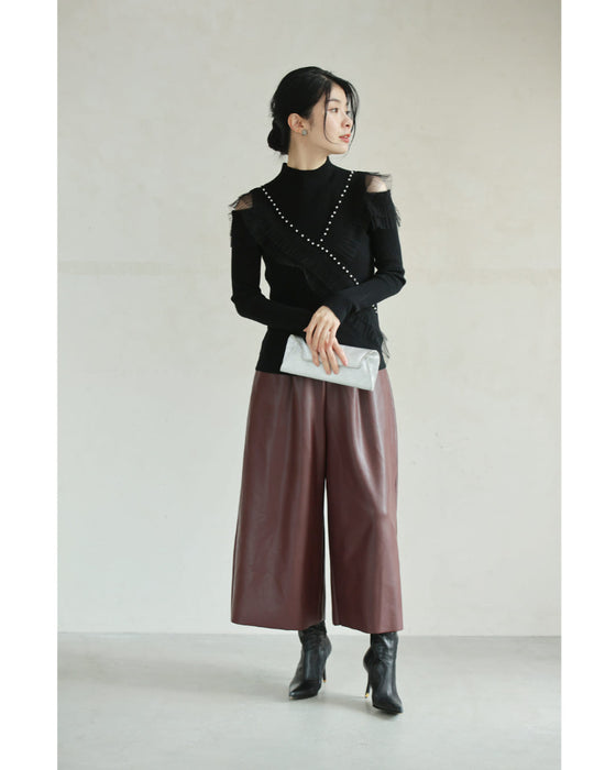 Ribbed knit cut-and-sew top with overlapping tulle ruffles and jewels
