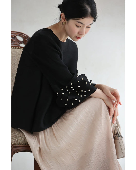 パール艶めく花びら袖のプリーツカットソートップス