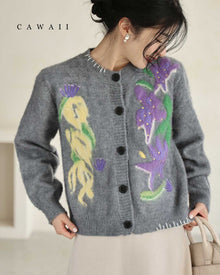  A knitted cardigan with a soft, floating botanical motif