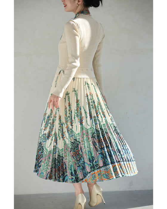 オリエンタルな柄が広がるドッキングプリーツミディアムワンピース(リボン付き)