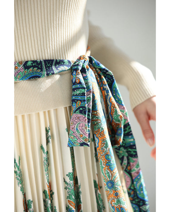 オリエンタルな柄が広がるドッキングプリーツミディアムワンピース(リボン付き)