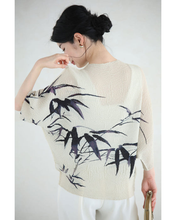 風に揺れるリーフ柄の伸びやかくしゅくしゅカットソートップス