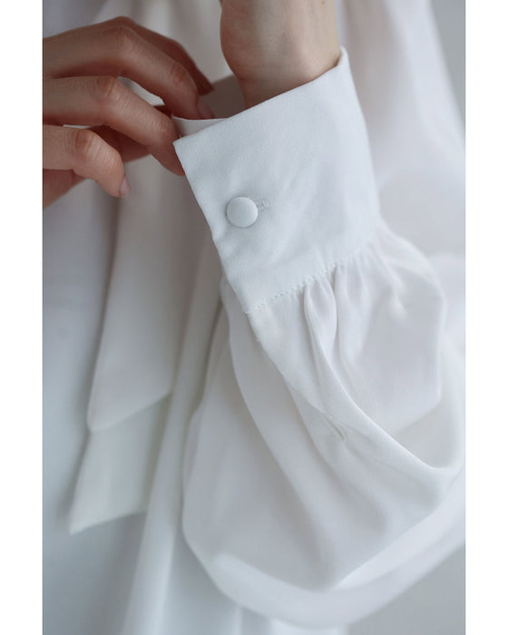 肩に咲く花コサージュのドレープブラウストップス