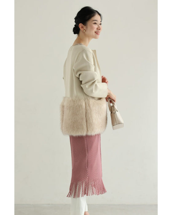 裾に揺れるフリンジの波うつバイカラーミディアムワンピース