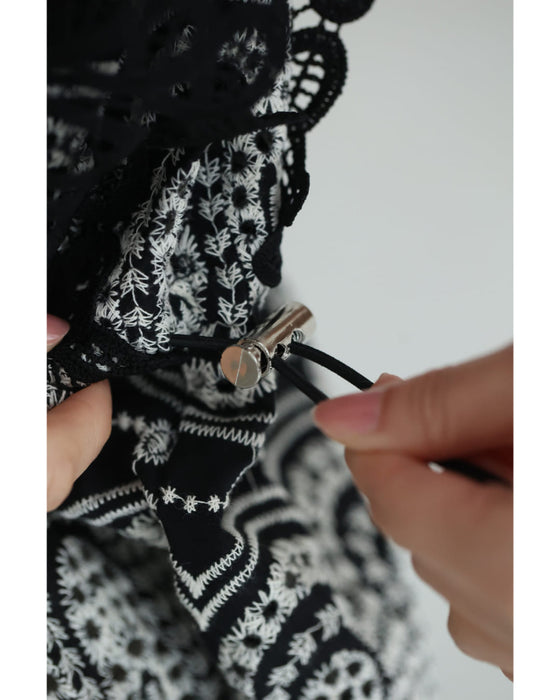 美しい装飾刺繍のペプラムカットソートップス