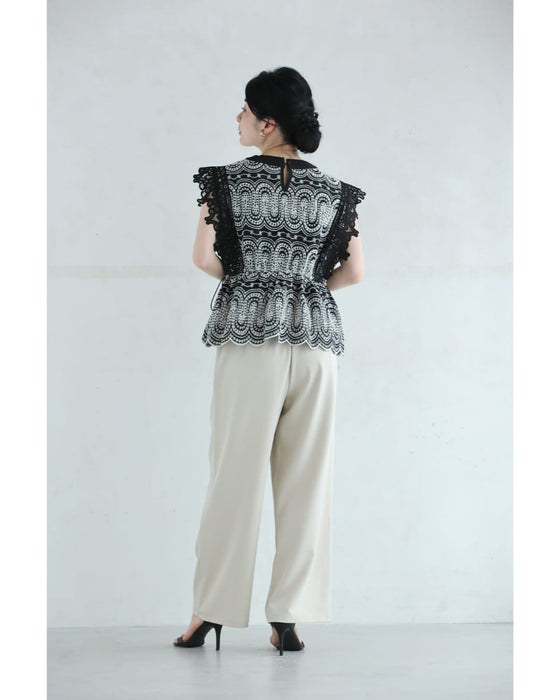 美しい装飾刺繍のペプラムカットソートップス