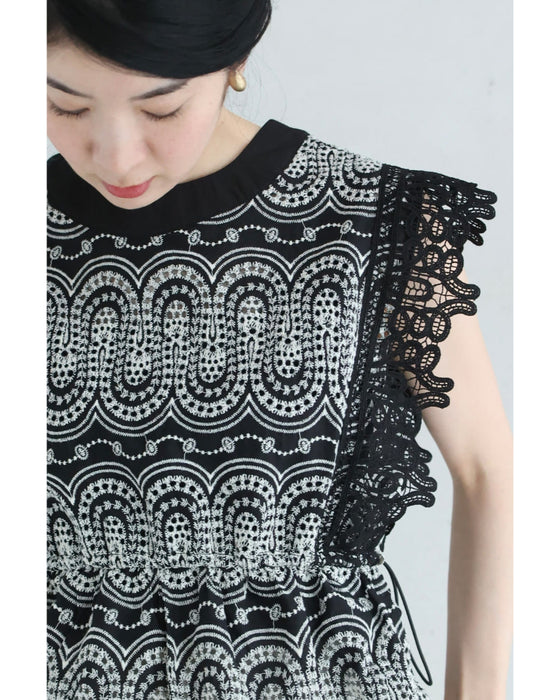 美しい装飾刺繍のペプラムカットソートップス