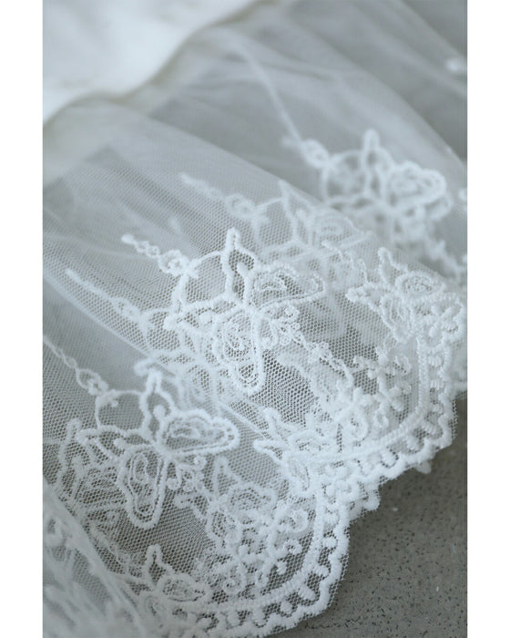 ひと匙のエレガントをプラスする裾チュールのTシャツトップス