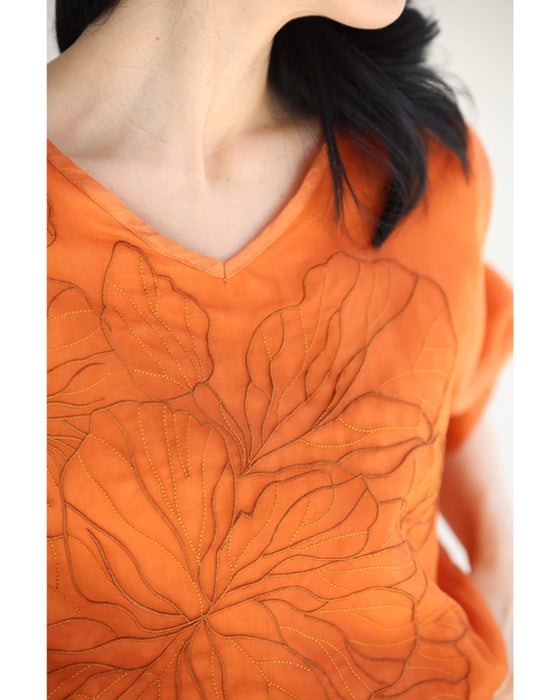 ベール重なる花刺繍のシアーブラウストップス
