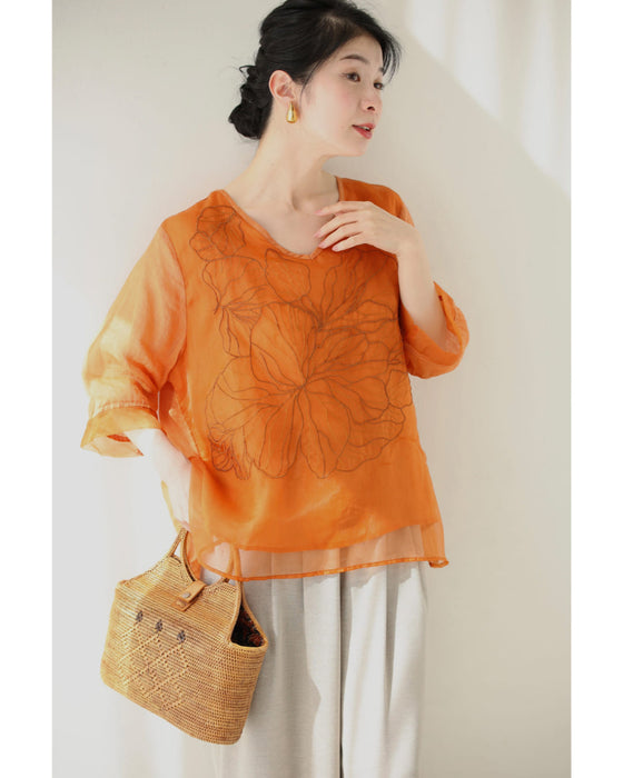 ベール重なる花刺繍のシアーブラウストップス