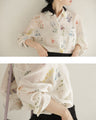 肌触り柔らかな花集めシアーシャツトップス