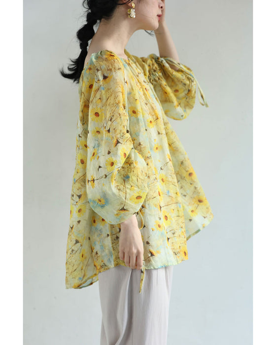 日差しに揺れるマーガレットのシアーブラウストップス