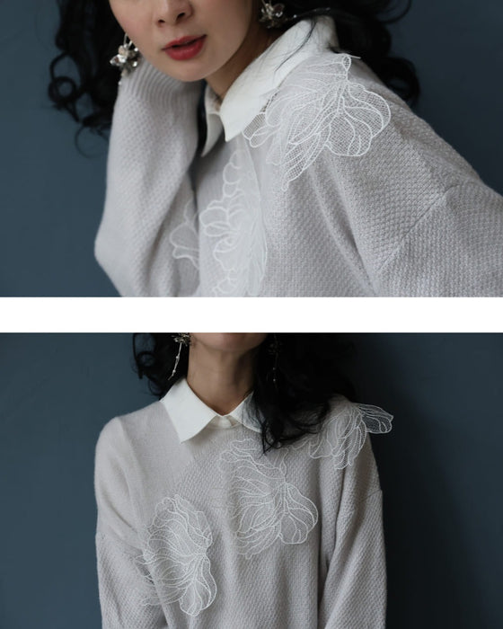 アシンメトリーなシアーデコルテの白花ニットプルオーバートップス