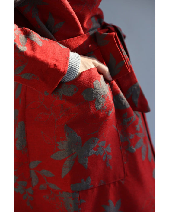 葉っぱのシルエット浮かぶ映える赤のロングコート(リボンベルト付)