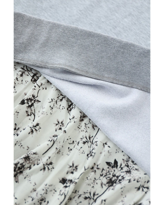 裾に広がる花柄の重ね着風スウェットロングワンピース