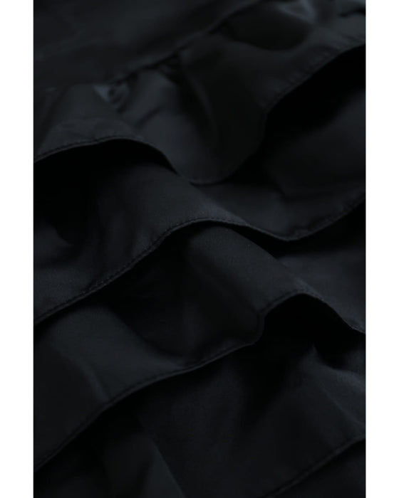 リボンを添えた重なるフリルチュニック