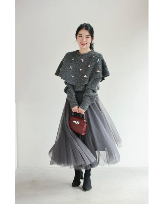 虹色の輝き放つオーロラスパンコールのケープニットプルオーバートップス