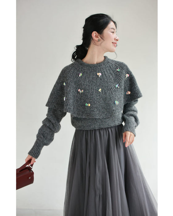 虹色の輝き放つオーロラスパンコールのケープニットプルオーバートップス