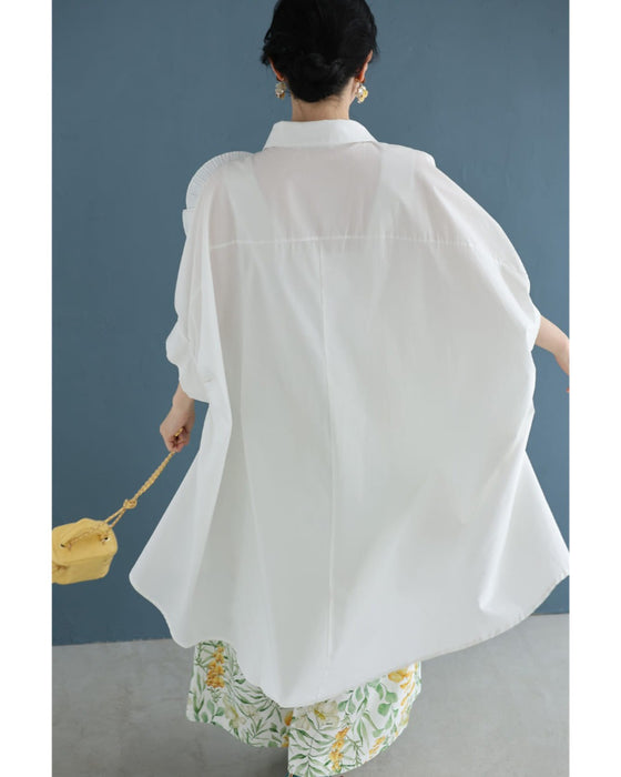 ロゼット風の花咲くフィッシュテールシャツトップス