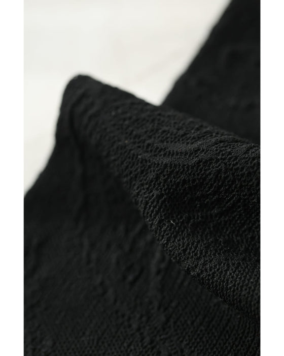 スパンコールの花咲くニットミディアムワンピース