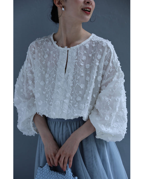 枝垂れる花のロング丈ブラウストップス