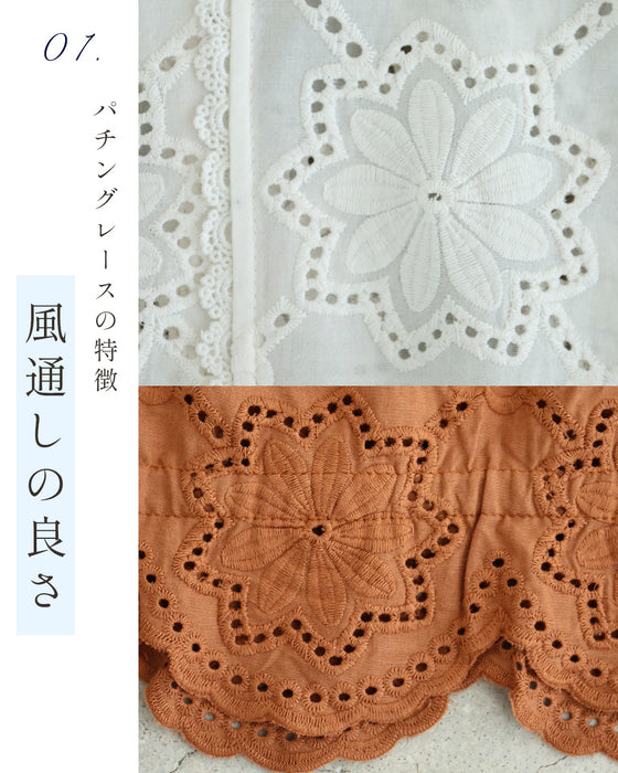 風舞い込むパンチングフラワーブラウストップス