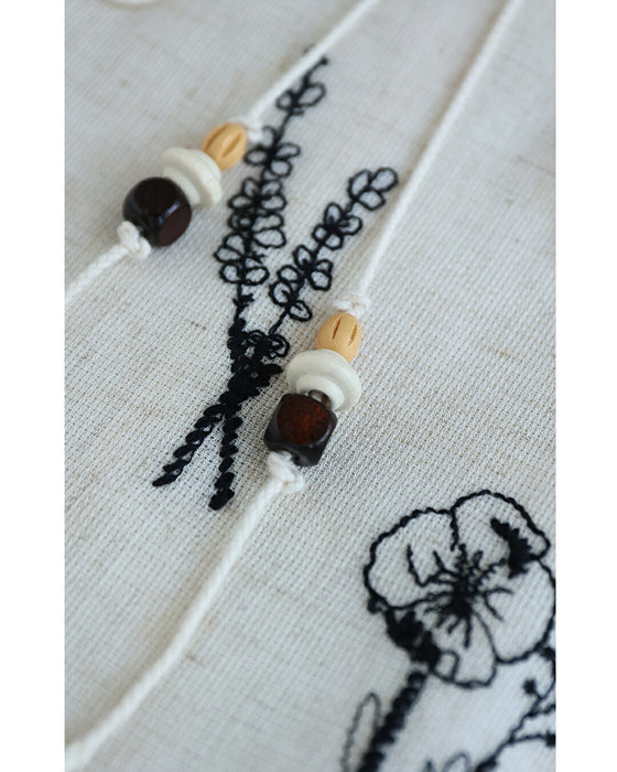 ウッドビーズ揺れる花刺繍ロングワンピース