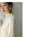 Knit top with puffed sleeves and off-neck puffed sleeves